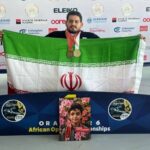 ایزدی مدال‌های طلا و برنز خود را به شهید ماکان نصیری اهدا کرد